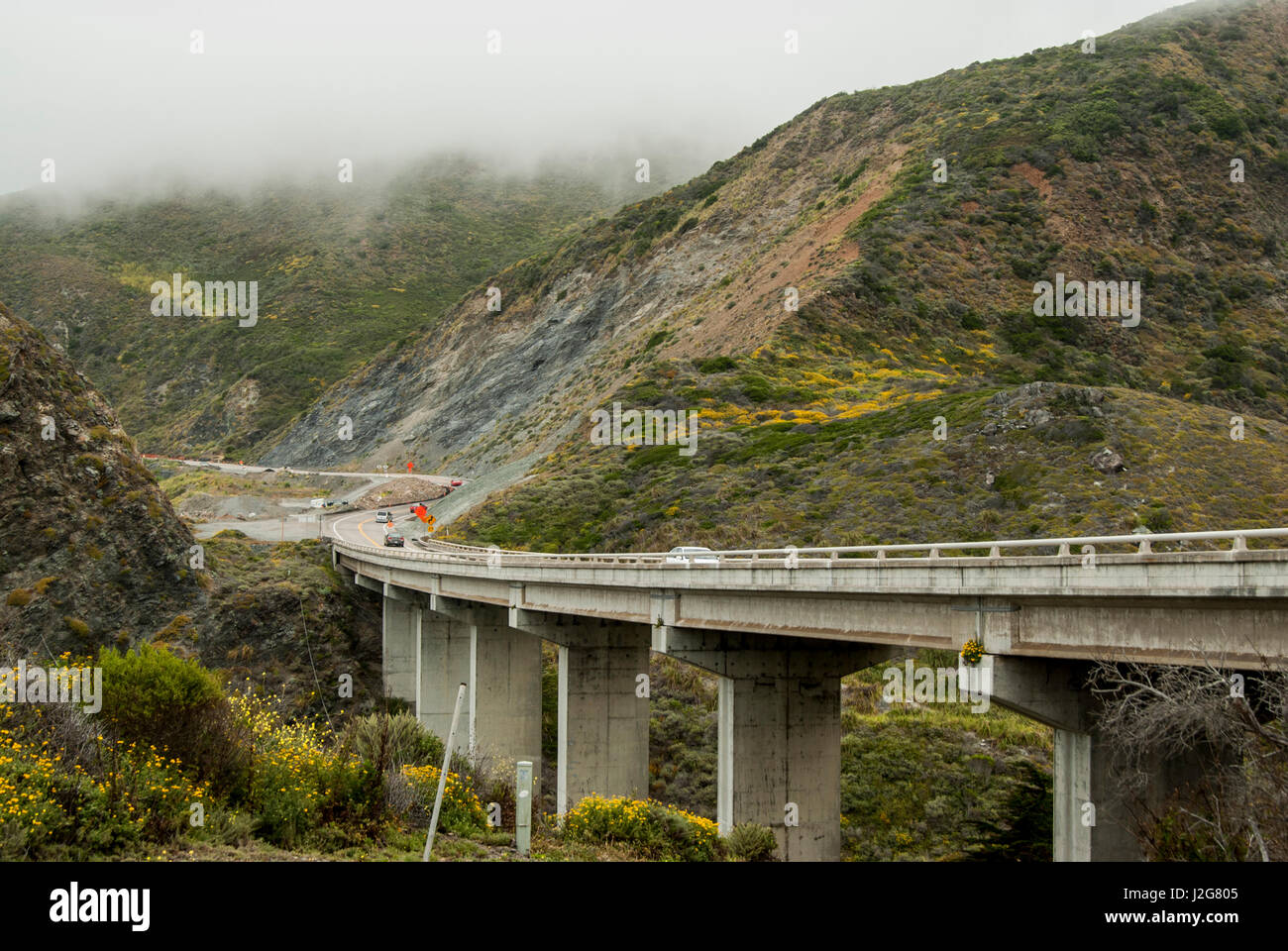 USA, California, Central Coast, Big Sur, bridge and road over Willow Creek, undergoing construction, fog Stock Photo