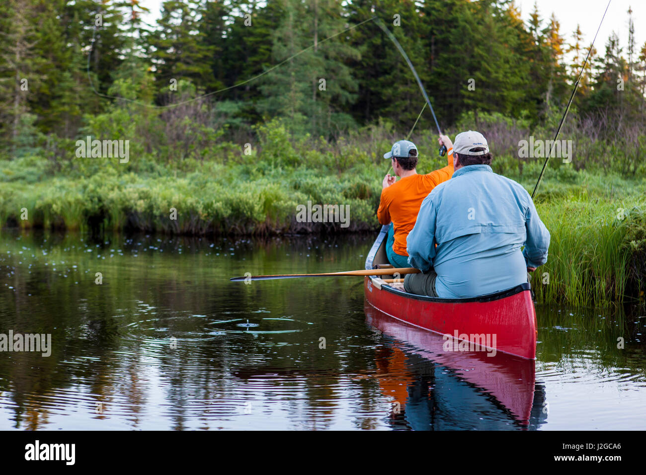 Two men flyfishing for brook trout from a canoe on the Cold Stream