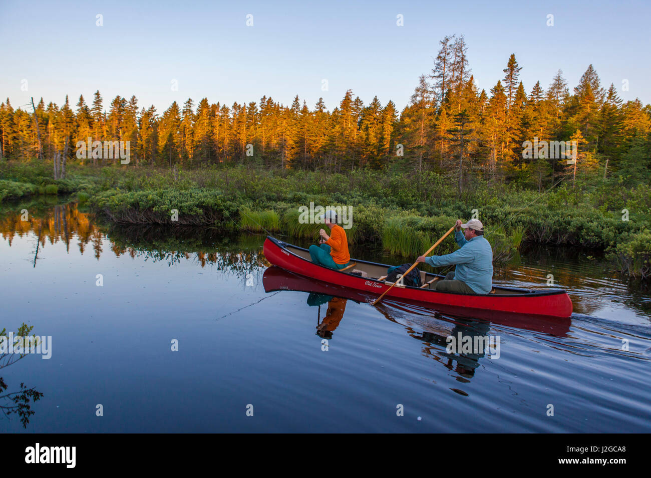Two men flyfishing for brook trout from a canoe on the Cold Stream