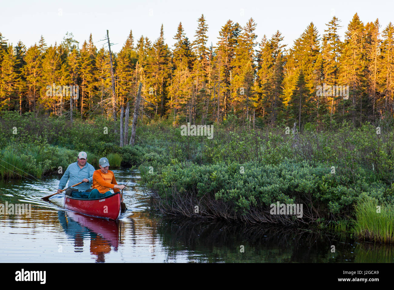 Two men flyfishing for brook trout from a canoe on the Cold Stream