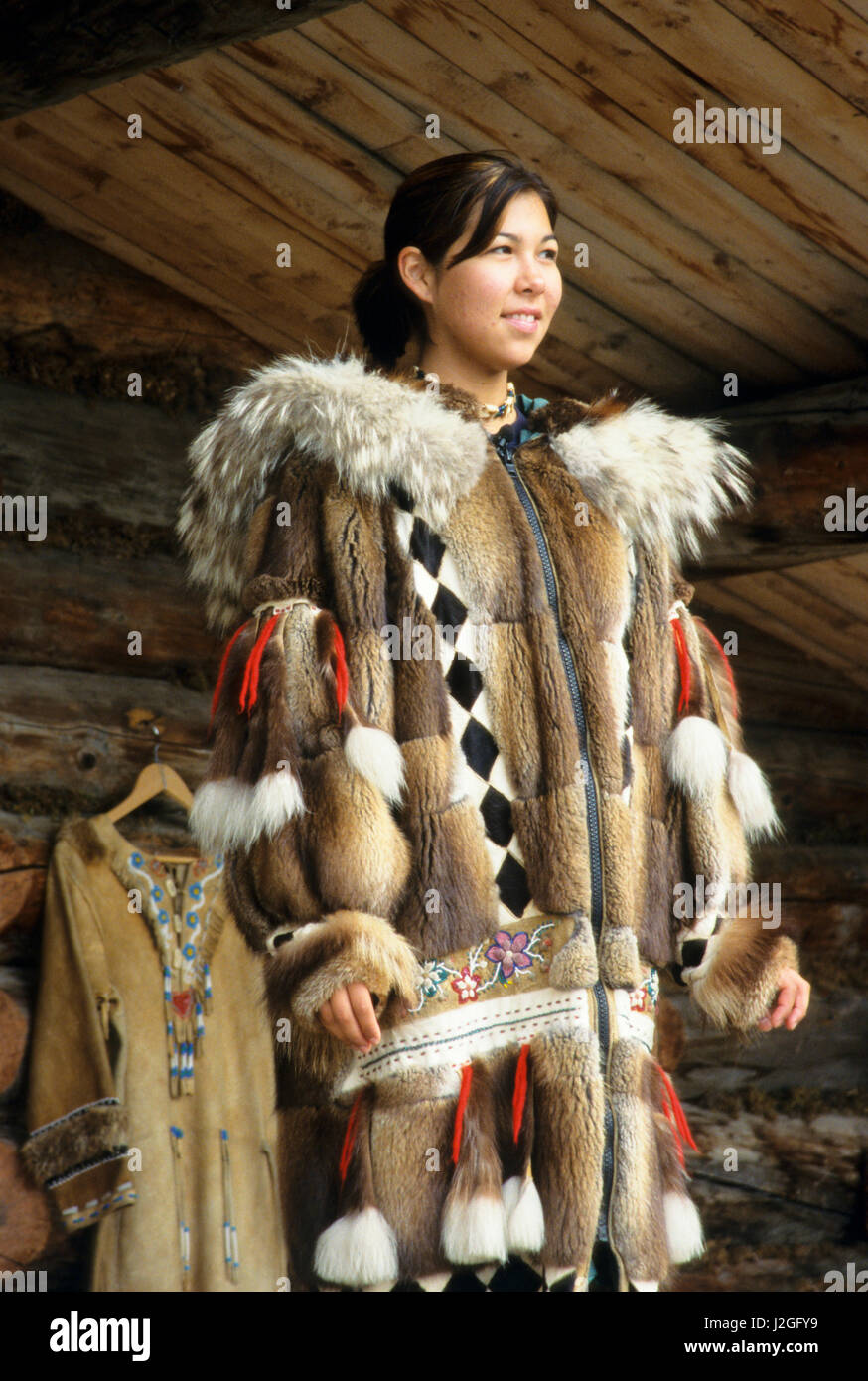 Athabaskan woman dressed in traditional animal fur parka made from ...
