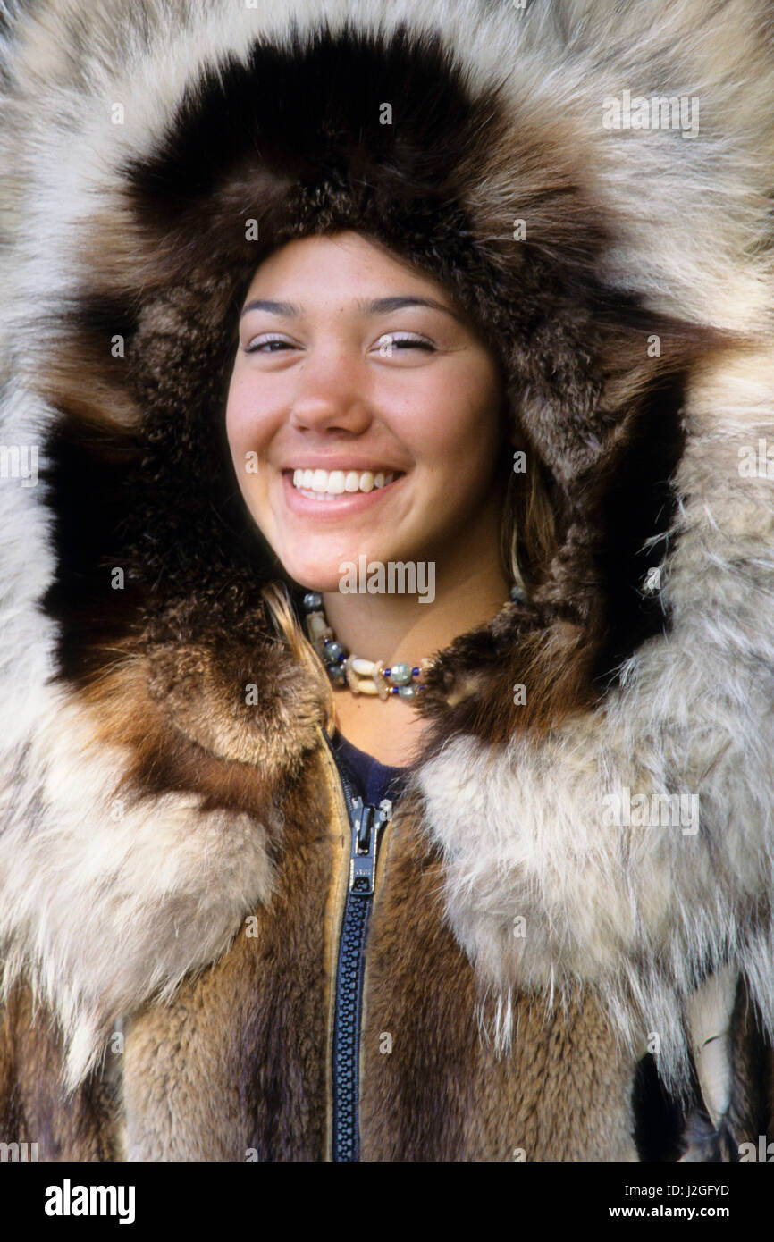 Athabaskan teenage girl wearing traditional animal fur parka with hood up  made from beaver and wolf skins, Fairbanks Alaska Stock Photo - Alamy