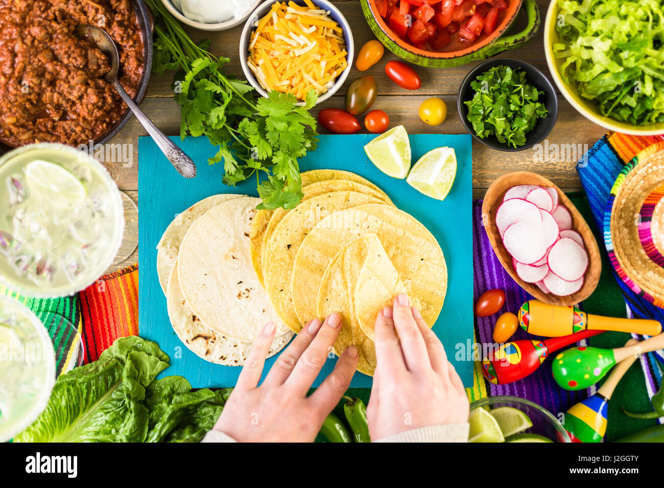 Ground beef tacos with romaine lettuce, diced tomatoes, radished, and