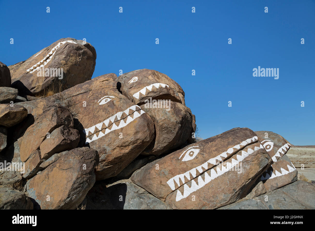 USA, California, Trona Pinnacles. Rocks painted with crocodile faces ...