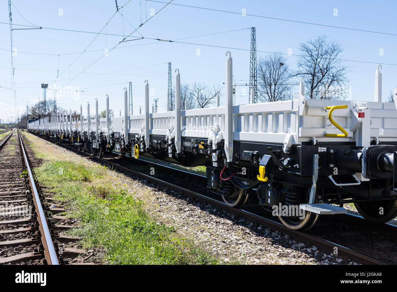 Burgas, Bulgaria - March 20, 2017 - Freight cargo train - 4axled flat wagon Type:Rens Model:192, B - Transvagon AD Stock Photo