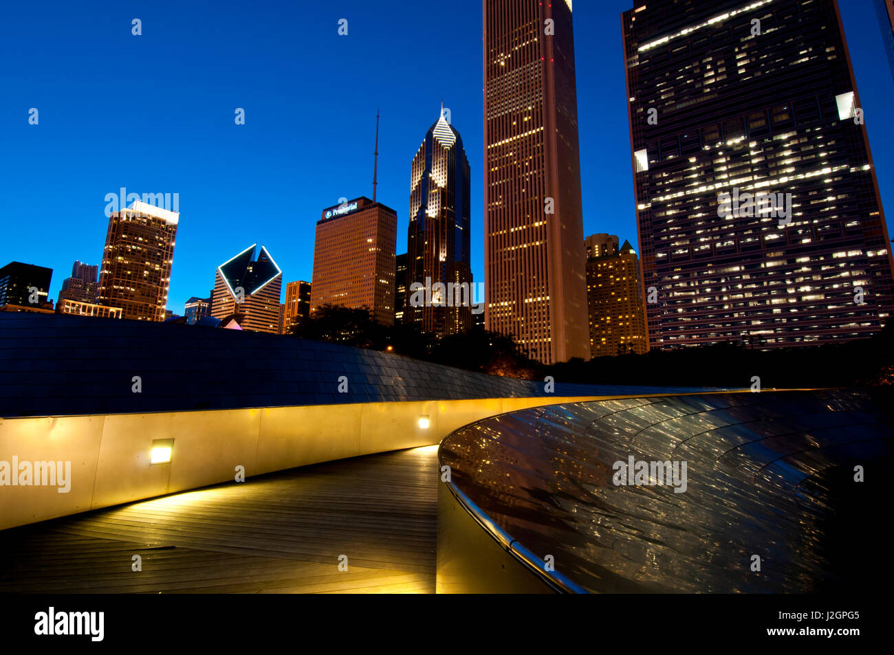 BP Bridge at Millennium Park and Chicago Skyline at dusk Stock Photo ...