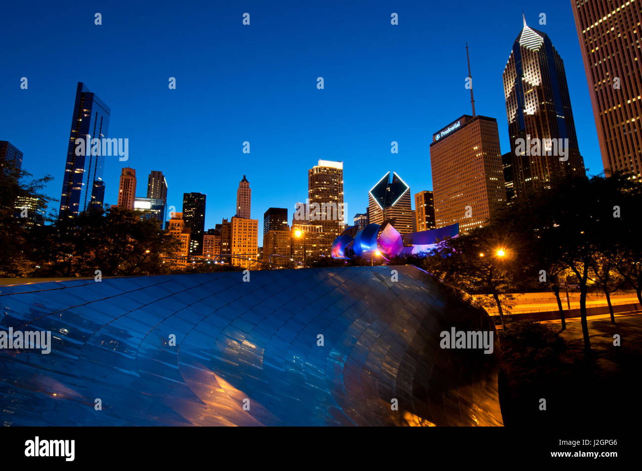 BP Bridge at Millennium Park and Chicago Skyline at dusk Stock Photo ...