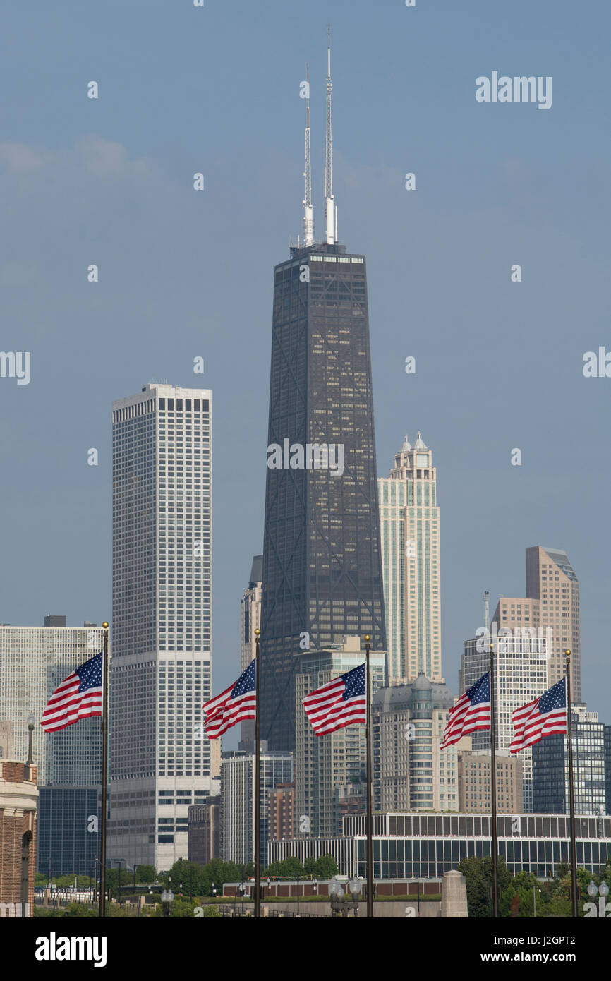Illinois, Chicago. Navy Pier, US flags flying in front of Chicago city skyline with John Hancock Tower. Stock Photo