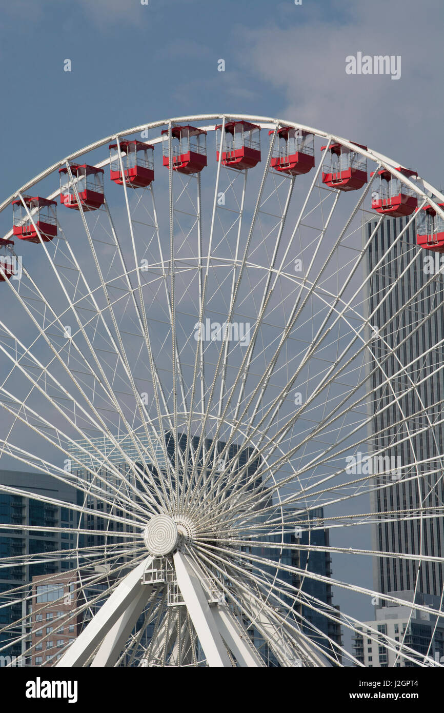 Illinois, Lake Michigan, Chicago. Detail of Navy Pier Farris wheel with Chicago city skyline in the distance. Stock Photo
