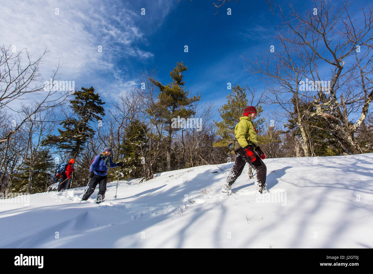 Hikers on the Hanson Trail in winter. Hanson Top on Green Mountain