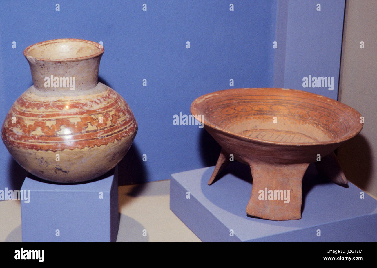 Ancient Aztec Pottery jar container and tripod bowl, both with painted designs, on display at the National Mexico museum in Zihuatanejo, Mexico Stock Photo