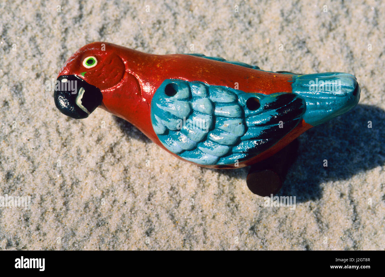 Aztec arts and crafts of a variety of painted clay whistles, one being of a colorful parrot bird effigy, Mexico. Stock Photo