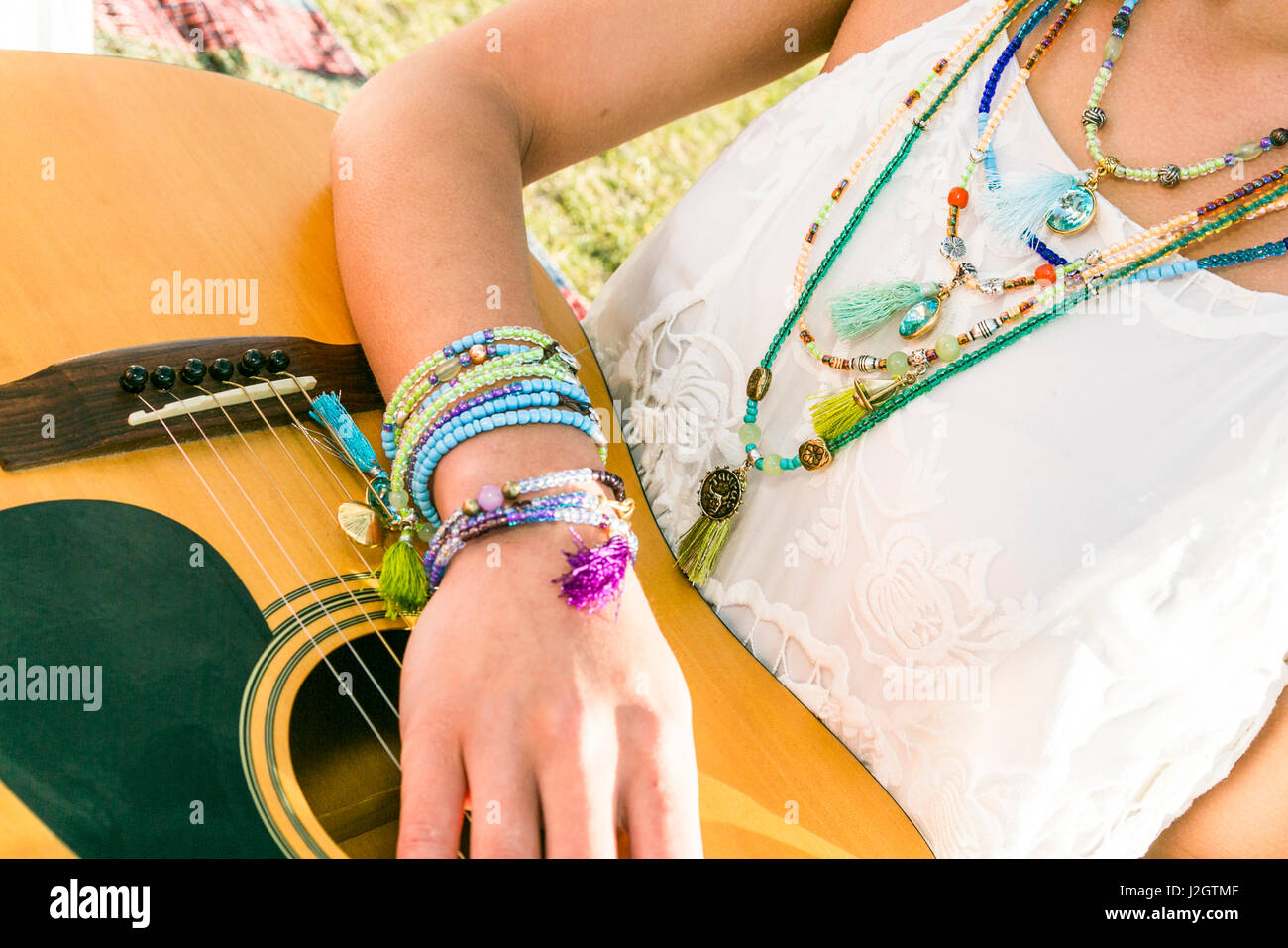 Young woman showing off Bottle Bead Jewelry, Santa Fe, New Mexico, USA. (MR) Stock Photo