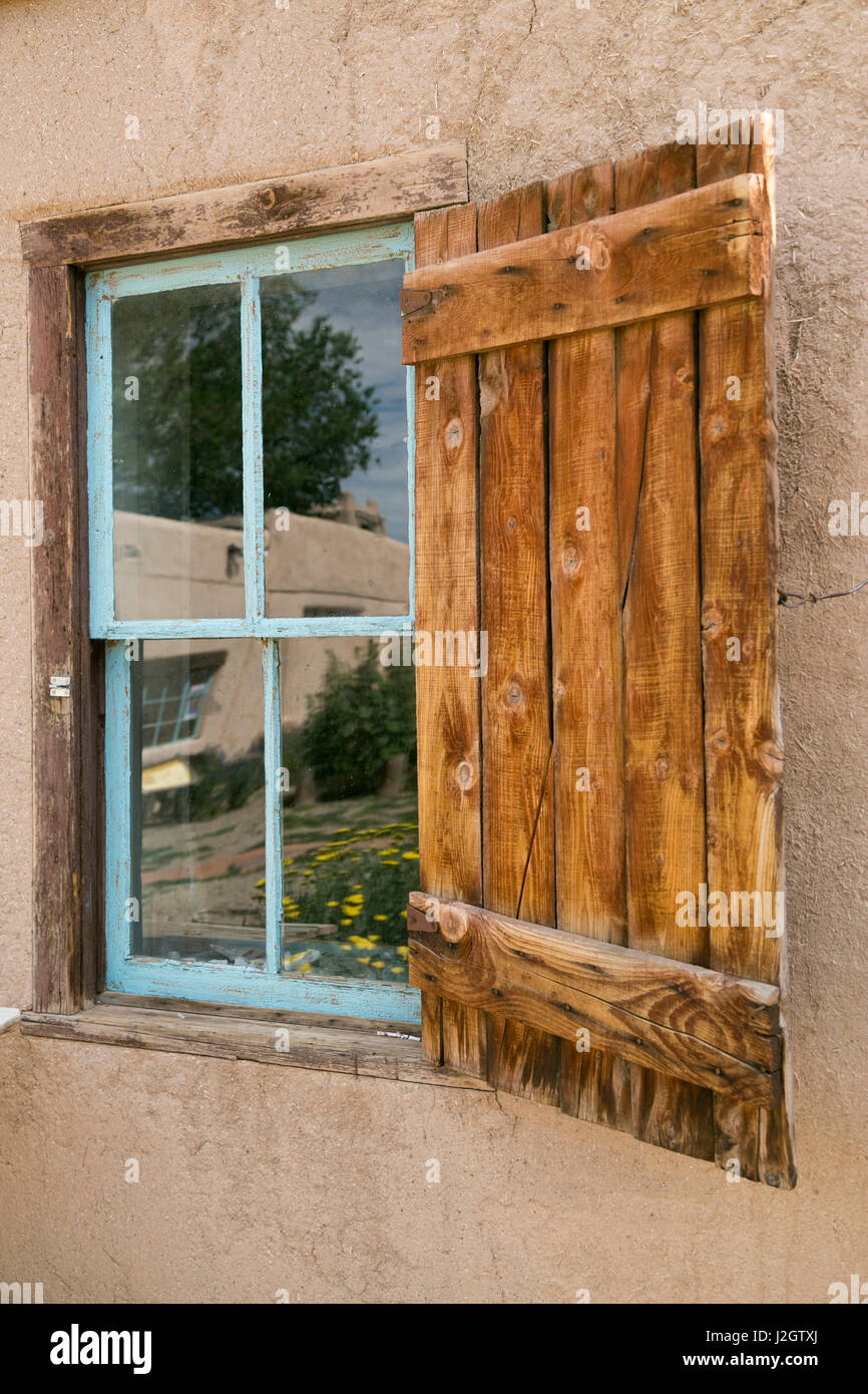 Rustic wooden shuttered window of the Kit Carson Museum, Taos, New Mexico, USA. Stock Photo