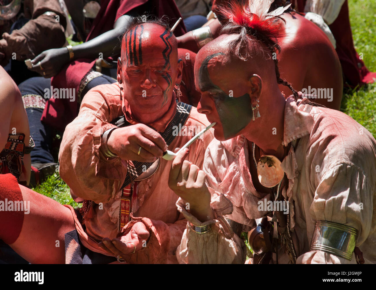 Native American Indians of the Northeastern Tribes place tobacco, also known as Kinnikinnick, in a pipe for a pipe ceremony during the Fort Niagara French Indian Wars Reenactment, NY Stock Photo