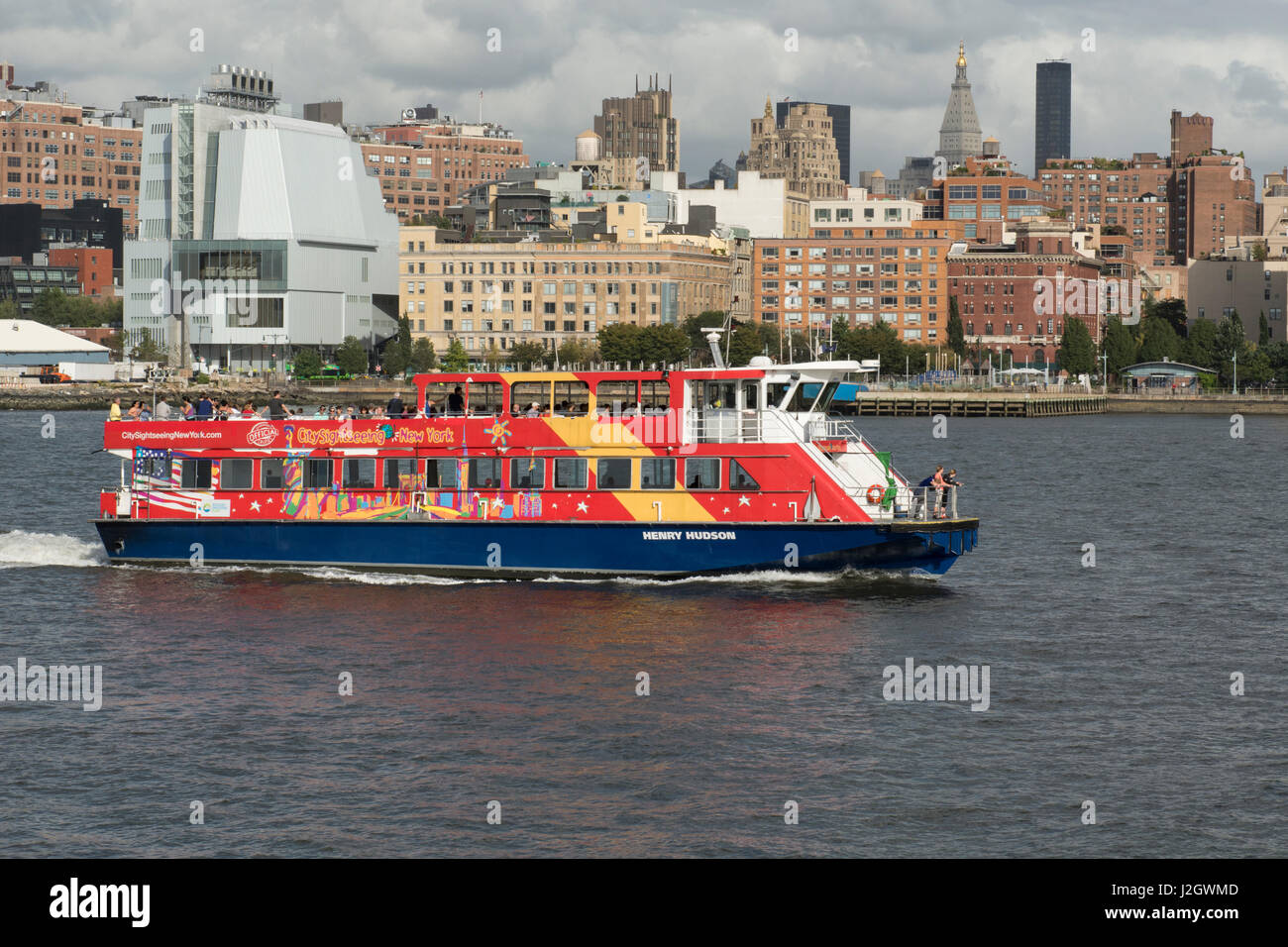 New York, New York City. Downtown city skyline. Hop-on Hop-off NY harbor sightseeing boat. Stock Photo