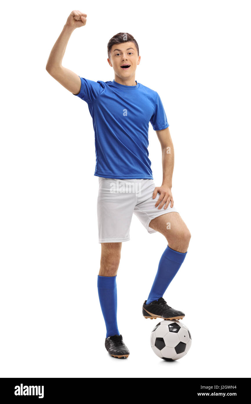 Full length portrait of a teenage football player gesturing happiness isolated on white background Stock Photo