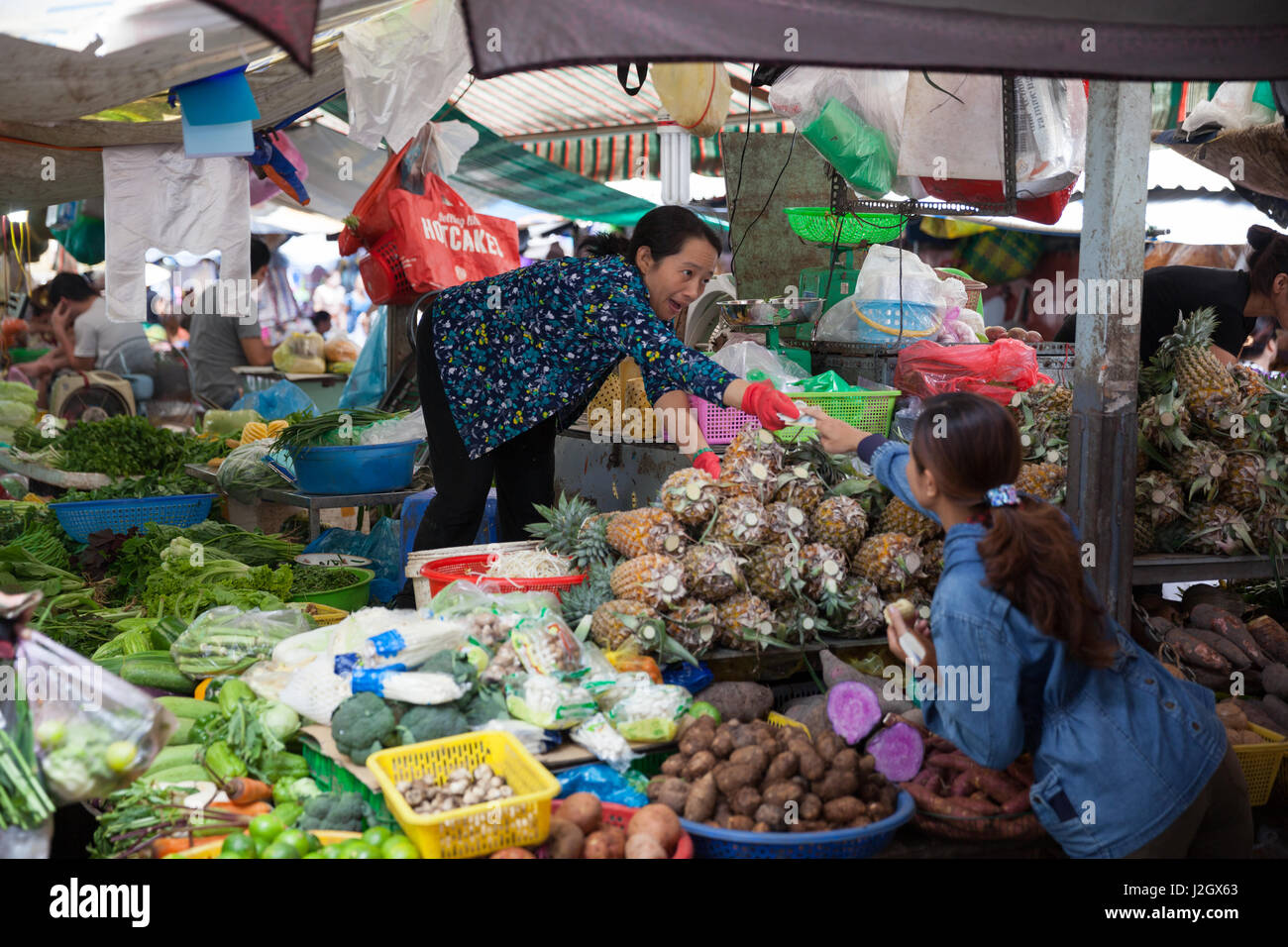 HO CHI MINH CITY, VIETNAM - NOVEMBER 21: Vietnamese woman is selling fruits and vegetables at the wet market on November 21, 2015 in Ho Chi Minh City, Stock Photo