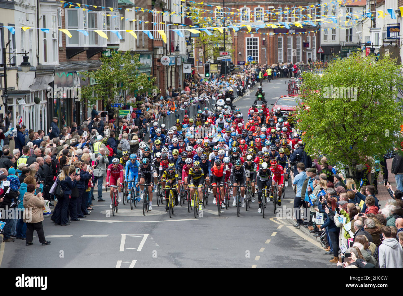 The peloton on stage one of the 2017 Tour De Yorkshire cycling race as it passes through the town centre of Driffield in East Yorkshire Stock Photo