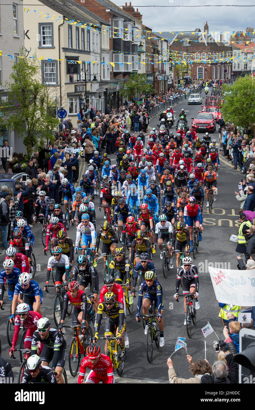 The peloton on stage one of the 2017 Tour De Yorkshire cycling race as it passes through the town centre of Driffield in East Yorkshire Stock Photo