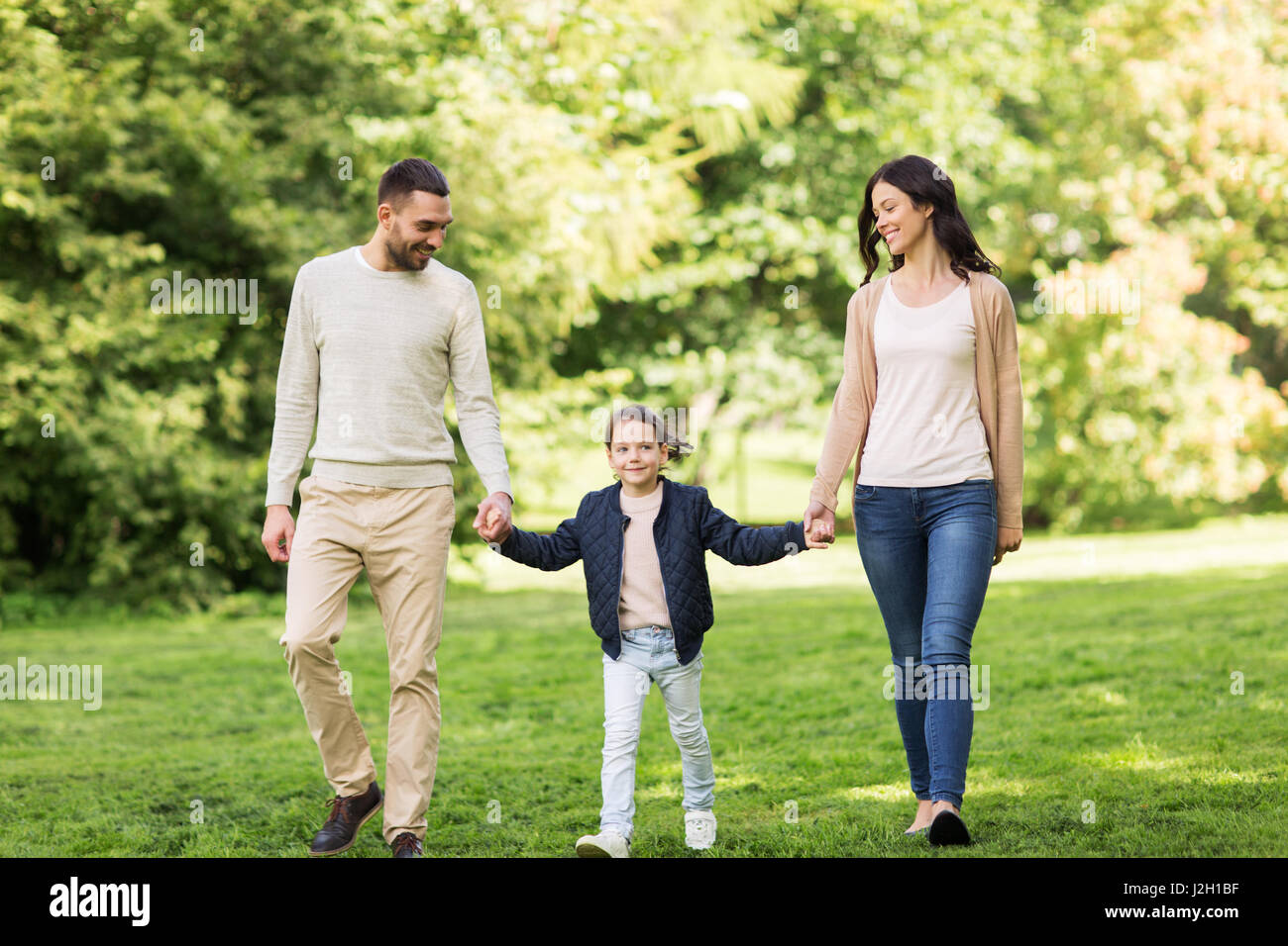 happy family walking in summer park Stock Photo - Alamy