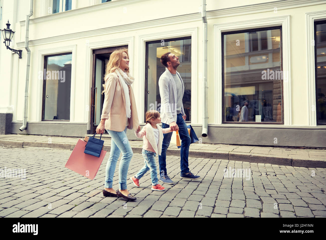 happy family with child and shopping bags in city Stock Photo