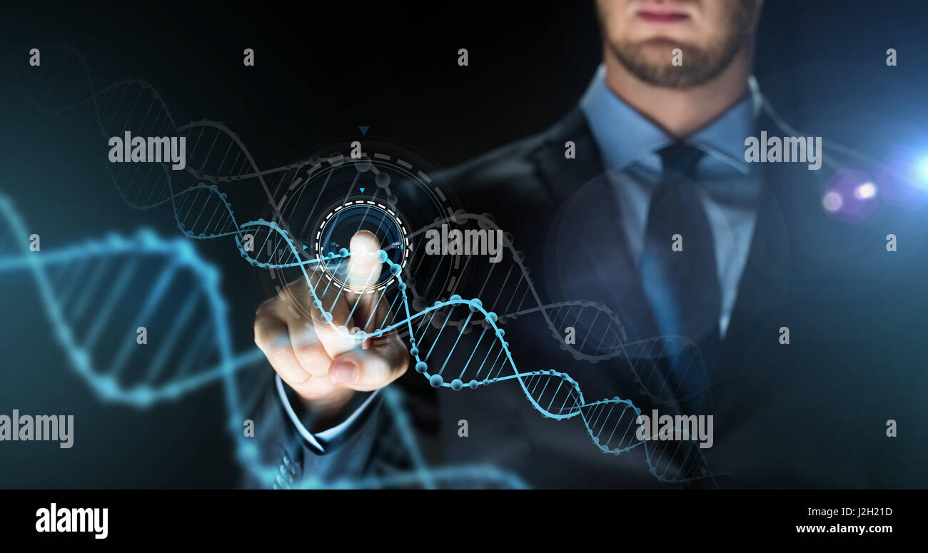 businessman with virtual dna molecule projection Stock Photo - Alamy