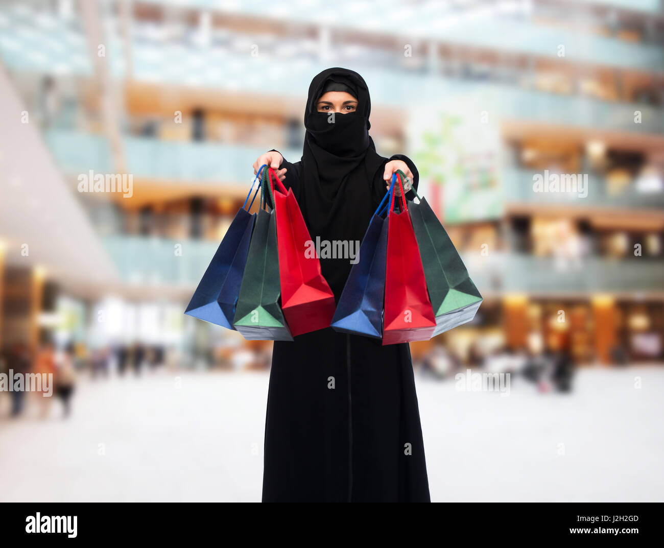 muslim woman in hijab with shopping bags Stock Photo Alamy