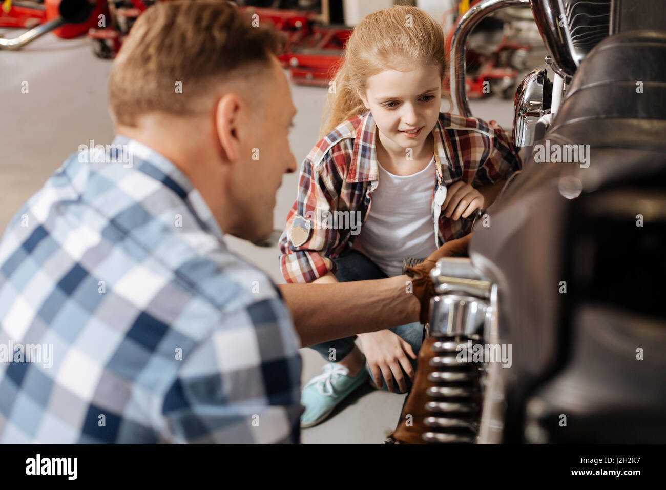 Brilliant eager child listening to dads lecture Stock Photo