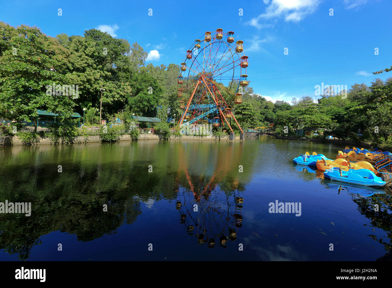 Ferris wheel inside the Foy's Lake Amusement World. It is a theme park. It was dug in 1924. Chittagong, Bangladesh. Stock Photo