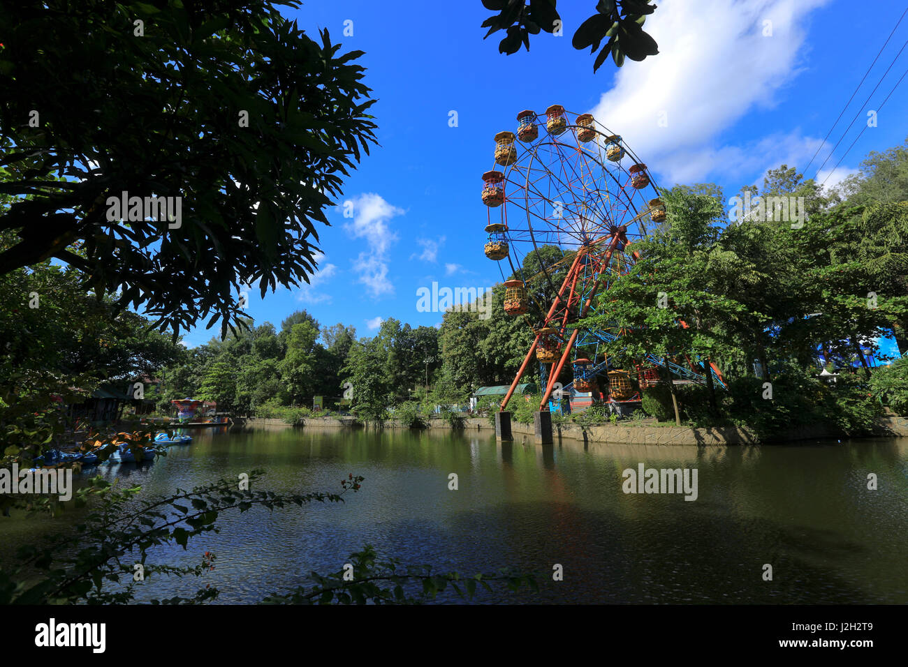 Ferris wheel inside the Foy's Lake Amusement World. It is a theme park. It was dug in 1924. Chittagong, Bangladesh. Stock Photo