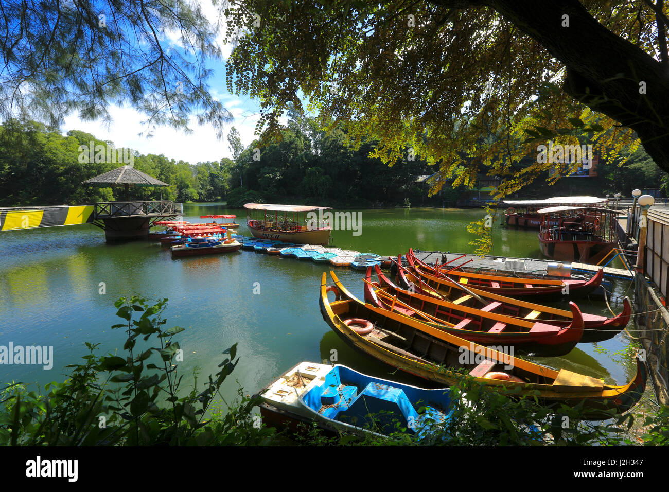 Wooden boats at the Foy's Lake Amusement World. It is a theme park. It was dug in 1924. Chittagong, Bangladesh. Stock Photo