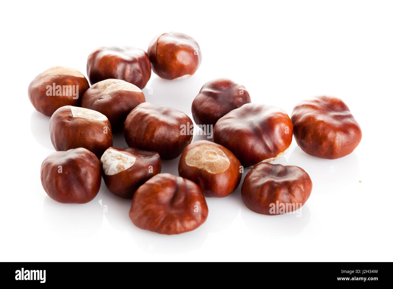 Chestnut on white background. ripe chestnuts Stock Photo - Alamy