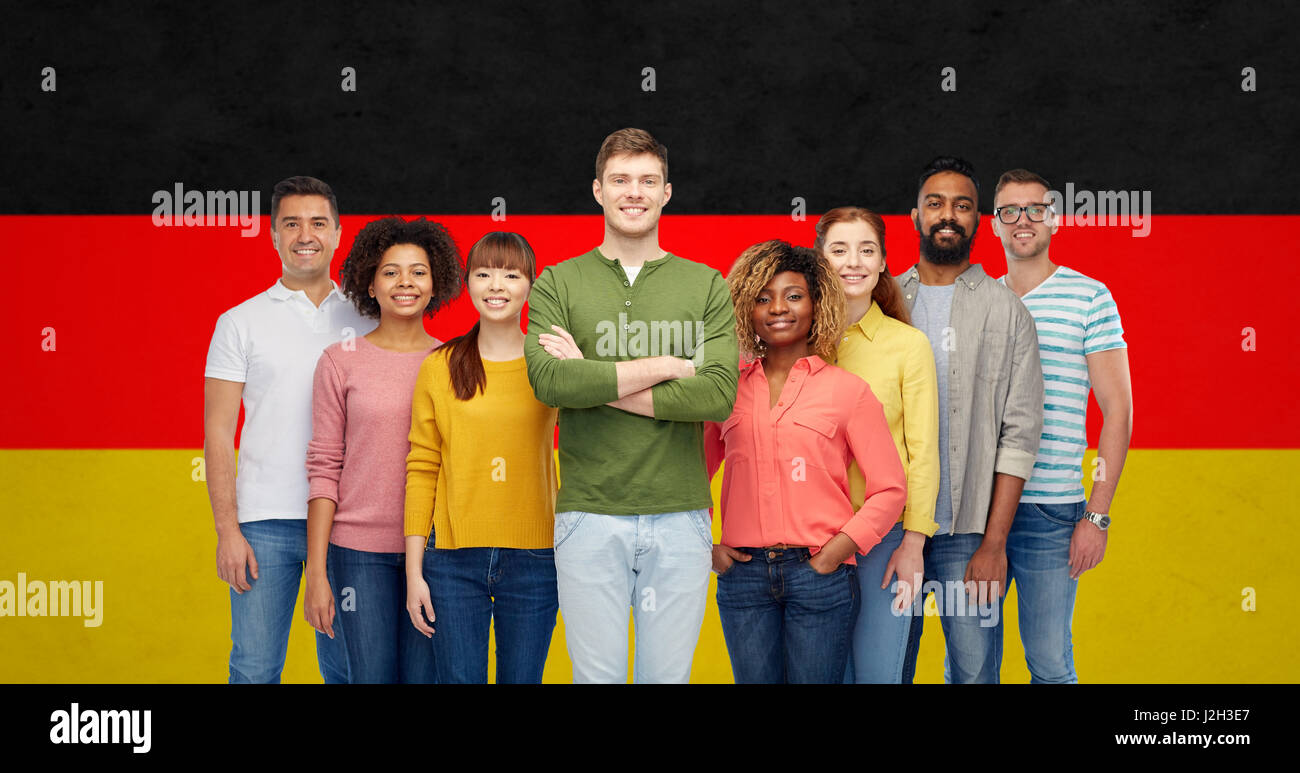 international group of people over german flag Stock Photo