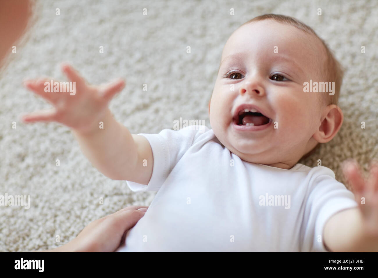 close up of happy little baby and mother Stock Photo