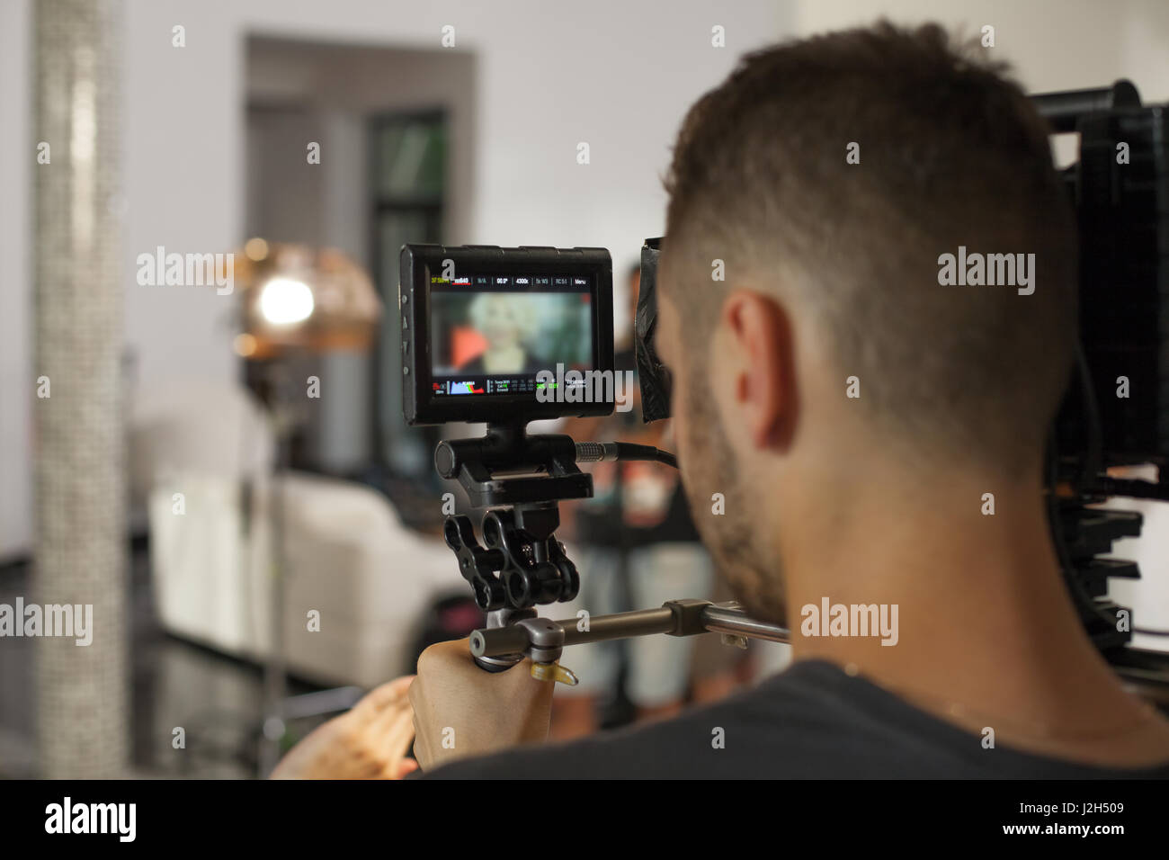 Operator Photo Operator while working with a large professional camera Stock Photo - Alamy