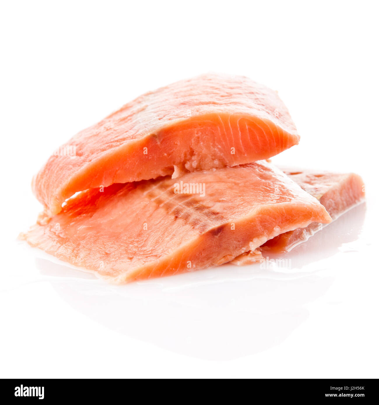fresh salmon steak over white background Stock Photo - Alamy