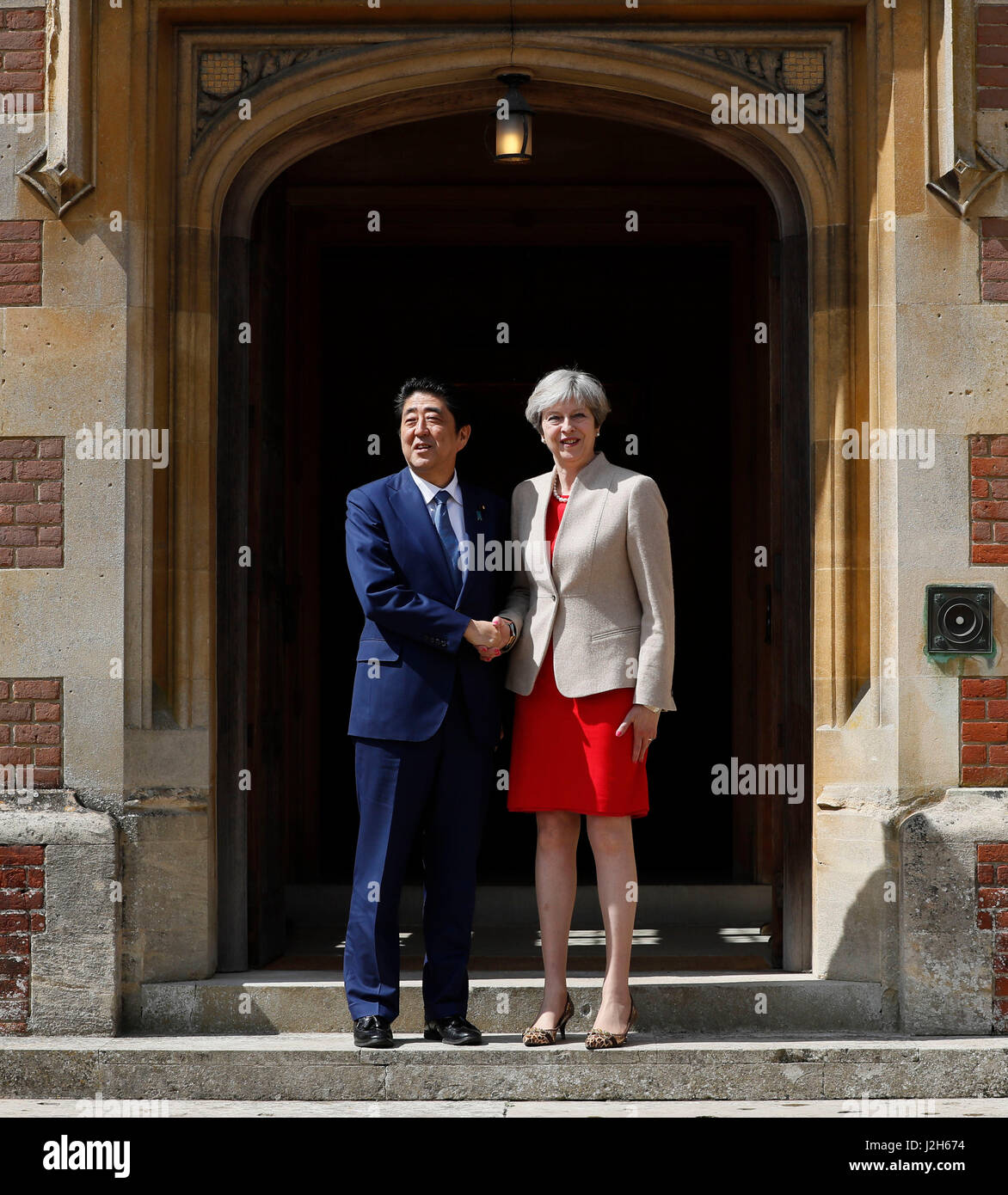 Prime Minister Theresa May welcomes Japan's Prime Minister Shinzo Abe ahead of talks at her country residence Chequers. Stock Photo
