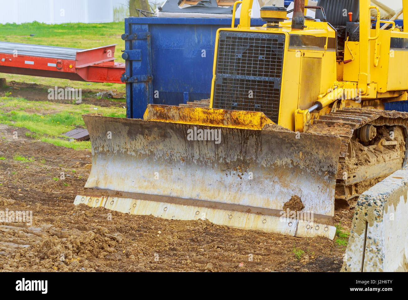 The tractor or Bulldozer on construction site digger, heavy duty construction equipment parked Stock Photo