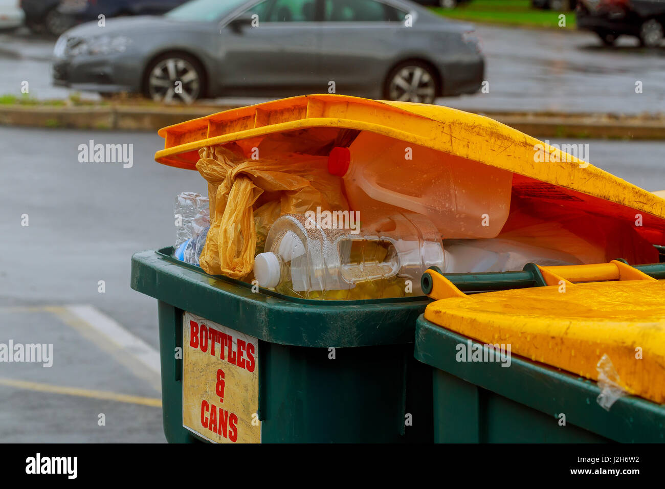 Overflowing garbage bins with household waste in the city Dumpsters