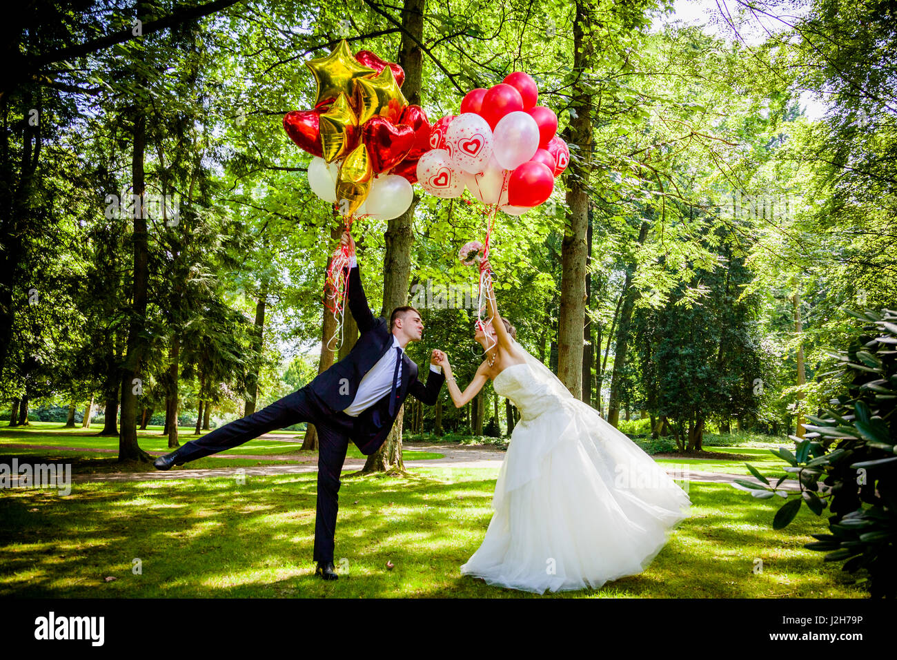 caucasian wedding couple with balloons Stock Photo - Alamy