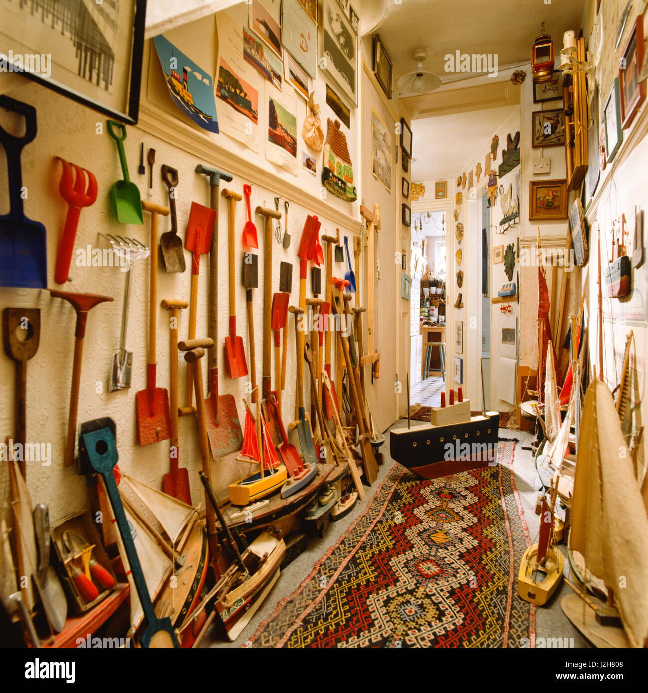 Garden implements hanging in hallway. Stock Photo