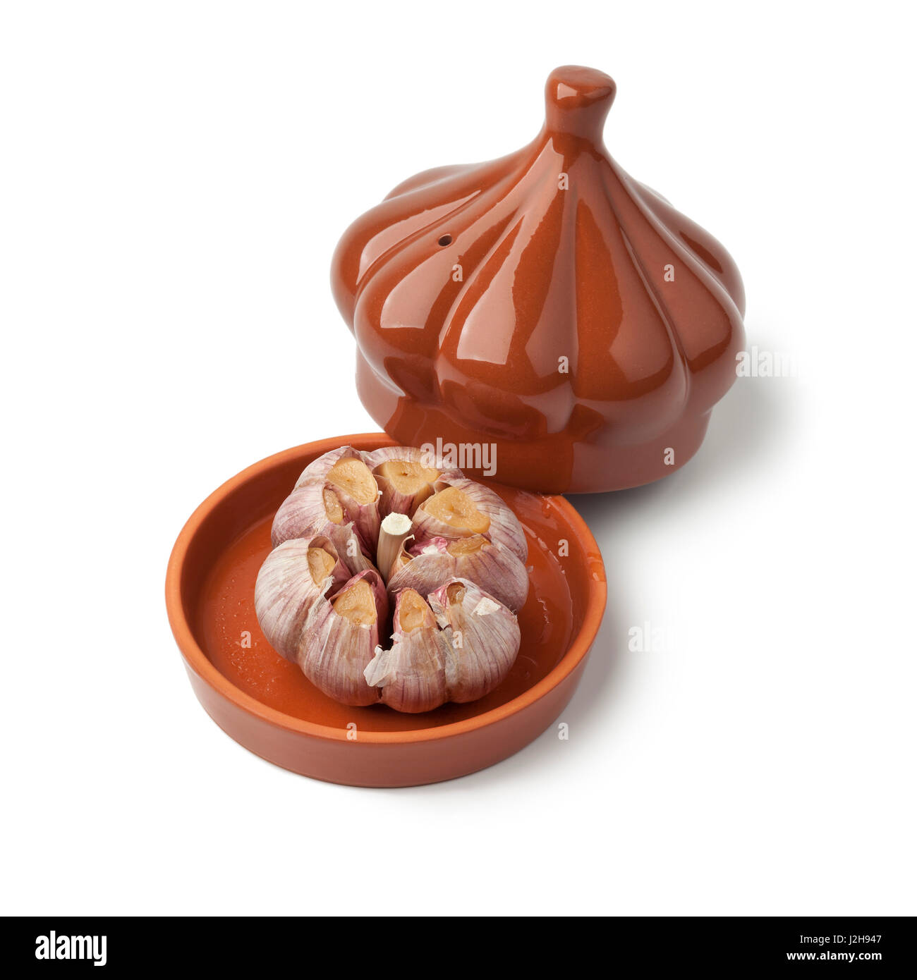 Roasted garlic in a ceramic bowl on white background Stock Photo Alamy
