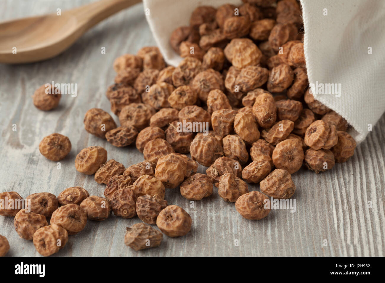 Sack with unshelled raw tiger nuts Stock Photo Alamy