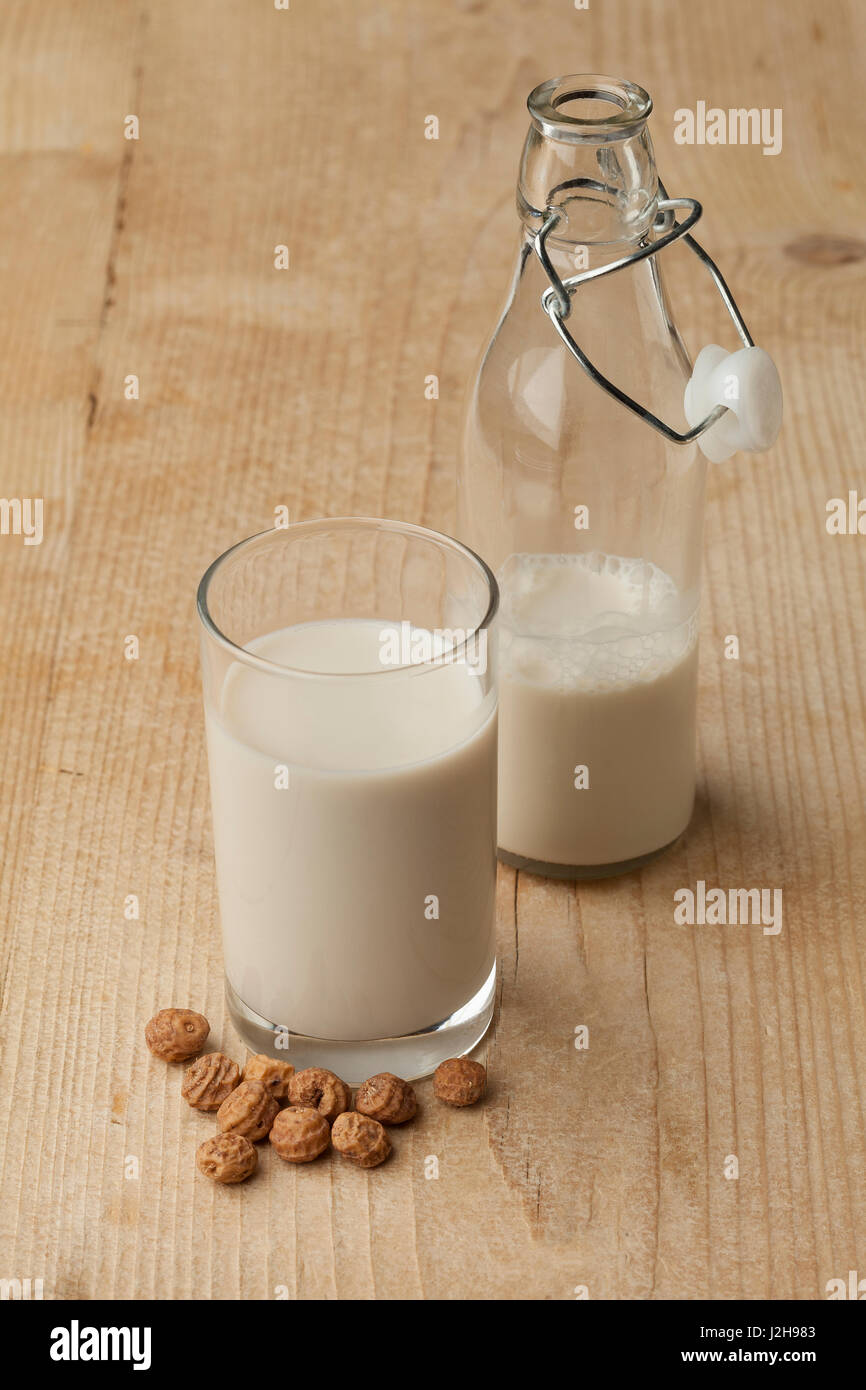 Glass Horchata milk and unshelled chufa nuts Stock Photo