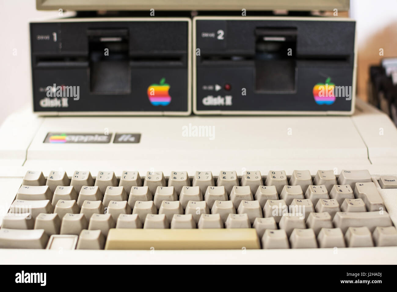 Keyboard and disk drive (blurred) of Aged Apple computer Stock Photo
