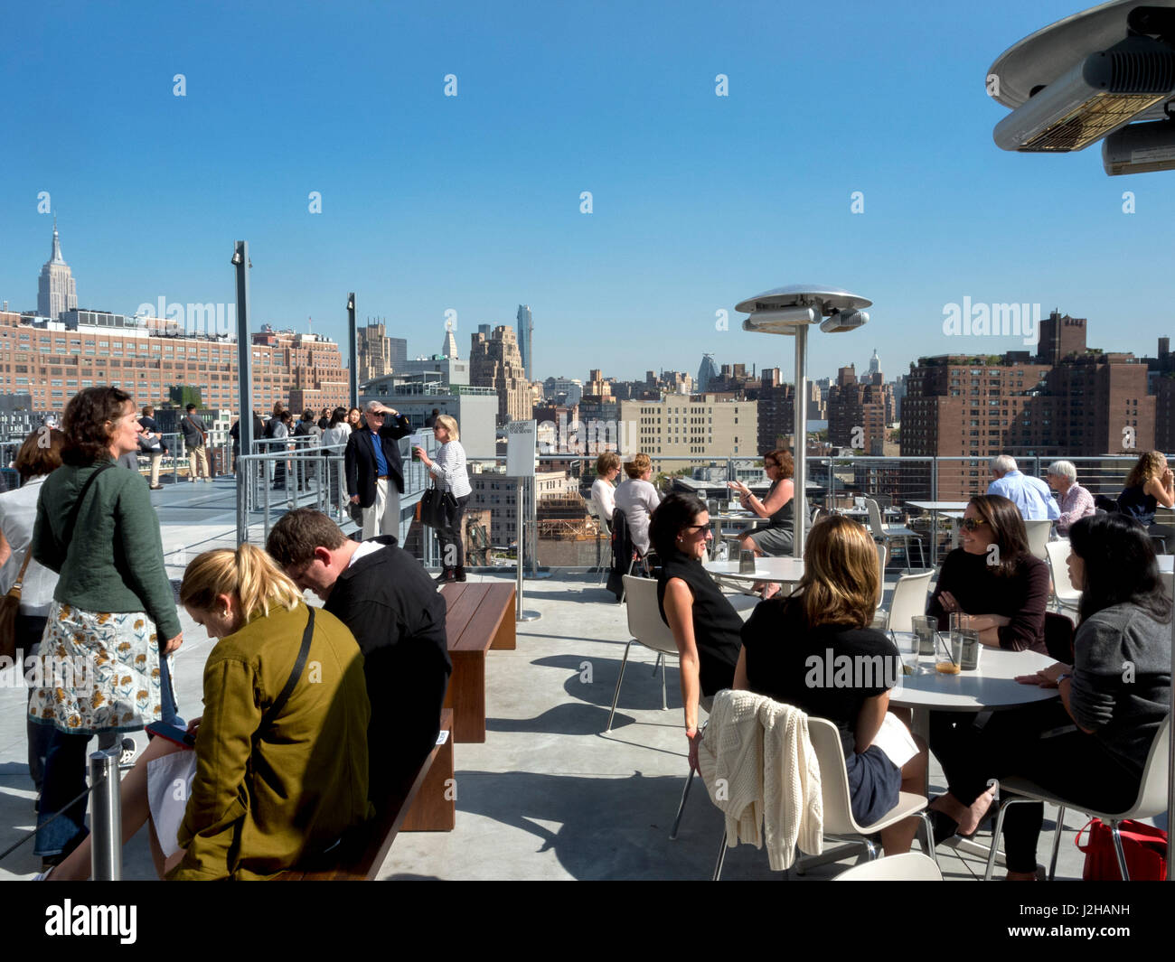 The roof top restaurant at the Whitney Museum of Art in New York City's gives diners a view of Manhattan's Meatpacking District. Stock Photo