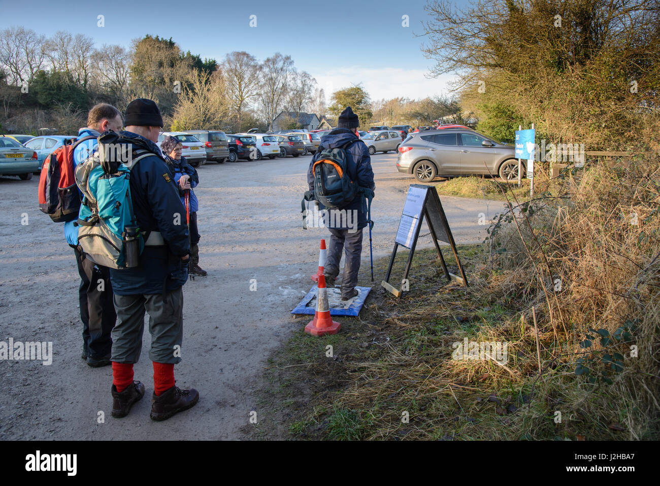 Visitors to RSPB Leighton Moss, Lancashire using a disinfectant pad when leaving the reserve after the discovery of a dead bird with bird flu. Stock Photo