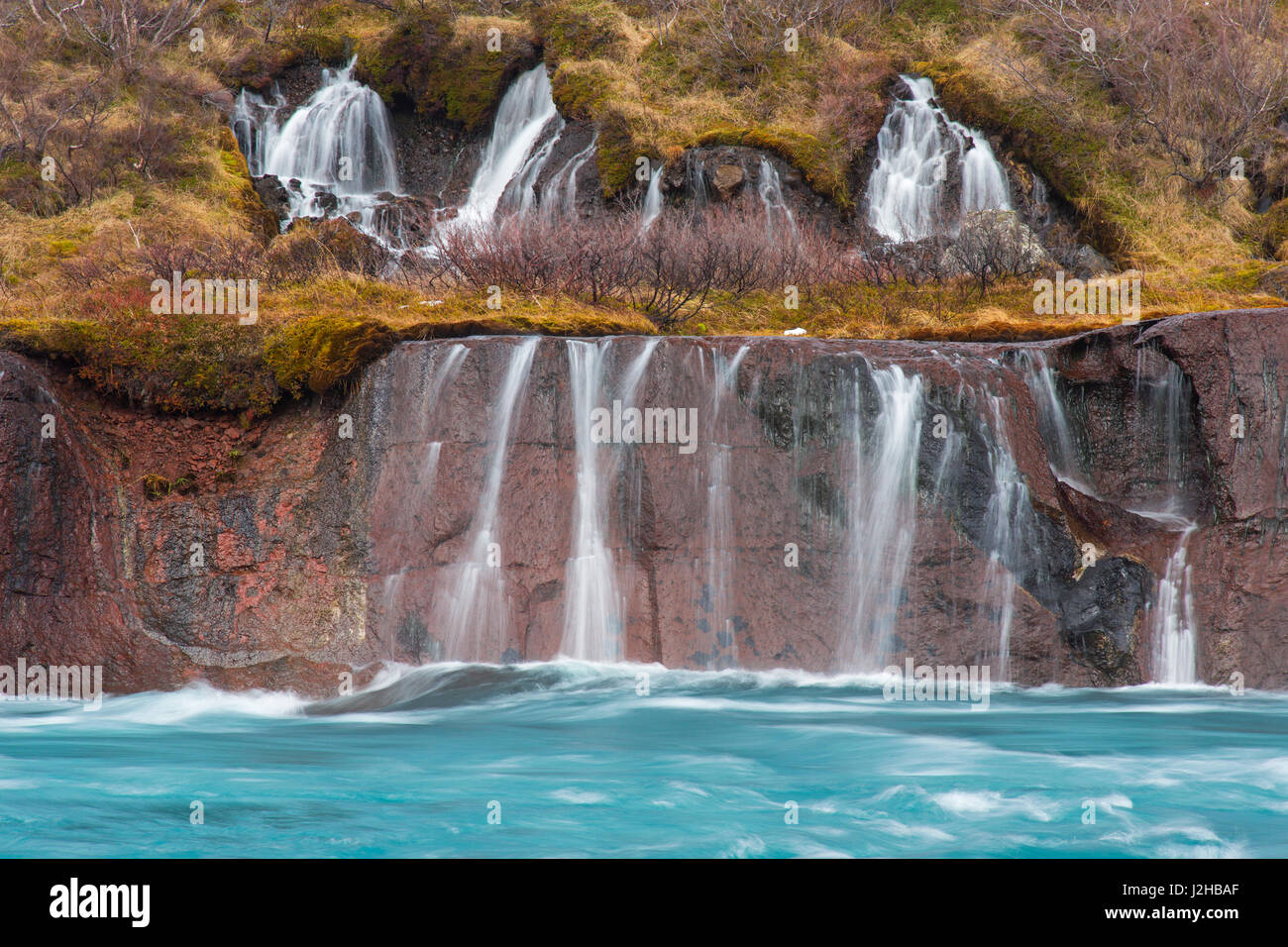Hraunfossar, series of waterfalls pouring into the Hvítá river in winter, Vesturland, Borgarfjörður, western Iceland Stock Photo