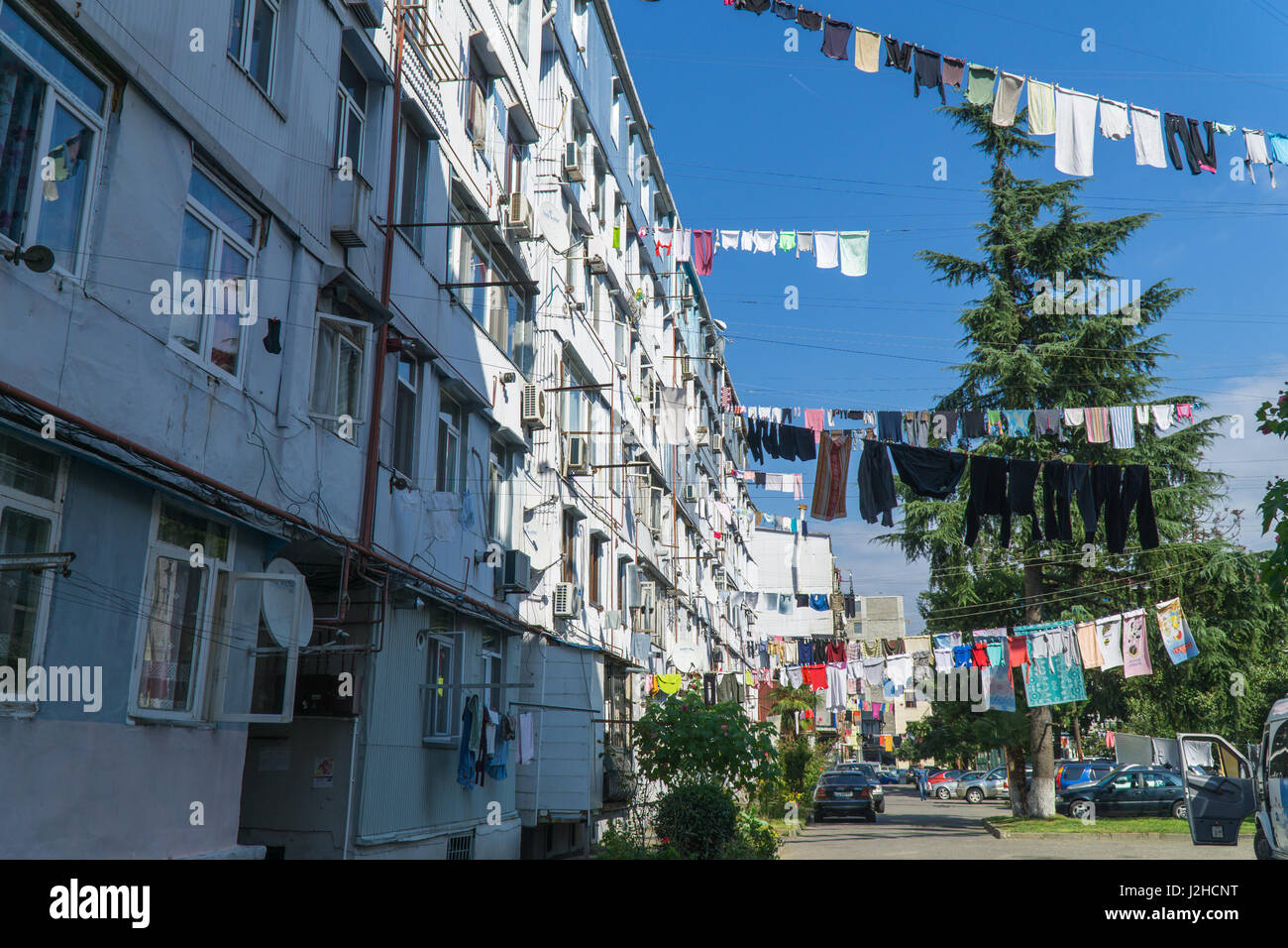Clothes drying in traditional way on the street of Batumi, Georgia. September Stock Photo